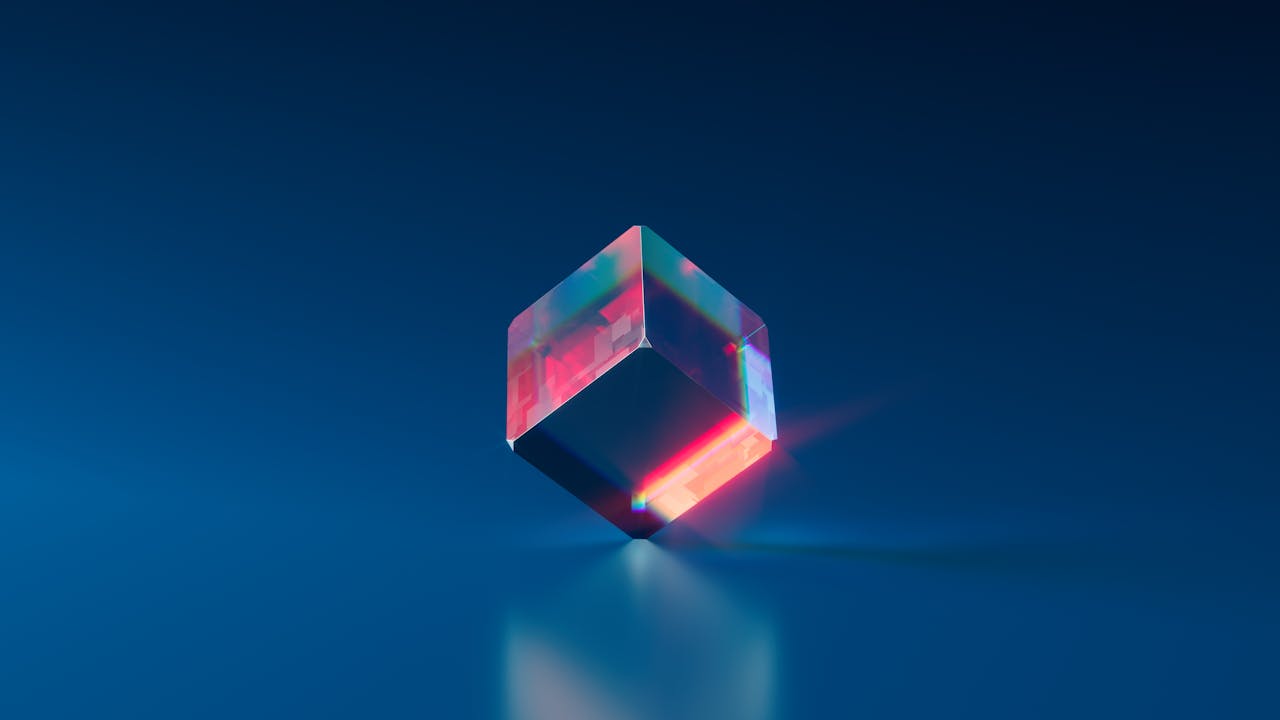 services-06 A vibrant and futuristic 3D cube with glowing edges on a dark blue background.